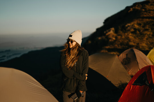 Adventure enthusiast at sunrise camp mountain range photography outdoor close-up freedom and exploration