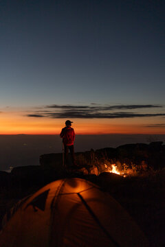 Adventurous night hike mountain peak outdoor exploration twilight scenic view nature's beauty