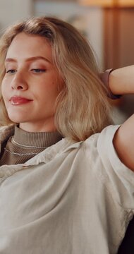 Thinking, girl and relax with stretching on sofa for weekend break, stress relief or peaceful moment. Comfort, woman and tired exhale in home with reflection, cozy rest and satisfaction for me time