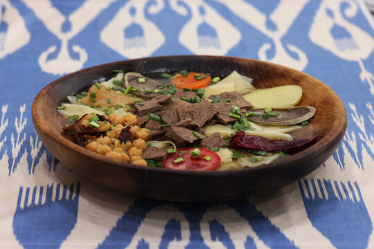 Traditional Central Asian Lagman Soup with Meat and Vegetables