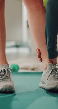 Exercise, home and legs of woman stretching for fitness routine, wellness and warm up. House, floor and person on yoga mat for workout, training and active hobby for balance, muscles and health