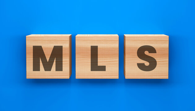 MLS Cubes: Wooden cubes displaying the letters MLS on a blue background, perfect for illustrating concepts related to real estate. 