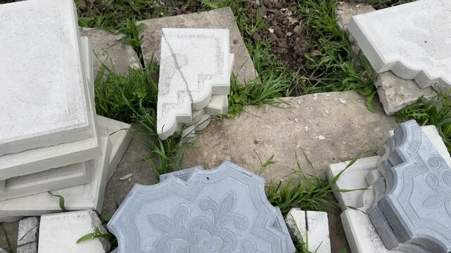Stacks of paving slabs on ground ready for walkway construction closeup