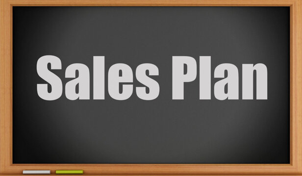 Sales plan on a blackboard with white text and wooden frame for business strategy and marketing