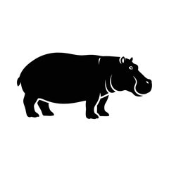 Obraz premium Silhouette of a massive hippopotamus standing proudly, a symbol of strength.
