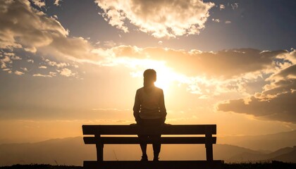 Obraz premium Silhouette of person on bench at sunset