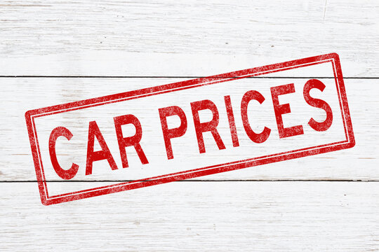 Car prices red distressed stamp on weathered wood