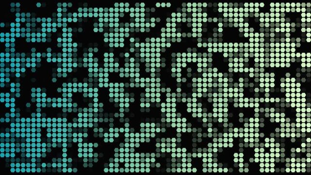 Digital mosaic pattern of glowing blue and green dots pulsing with light on black background dynamic motion footage.