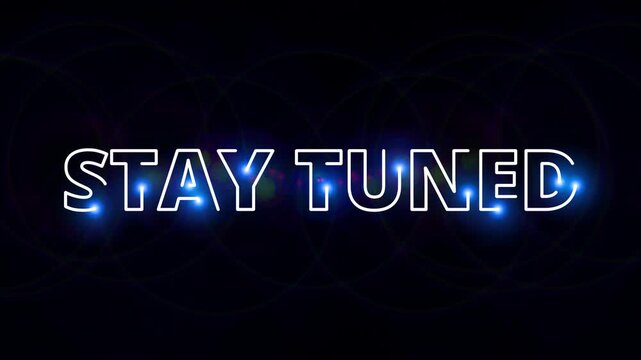 Stay tuned with a bright neon &ldquo;stay tuned&rdquo; message on a dark background for a marketing campaign.