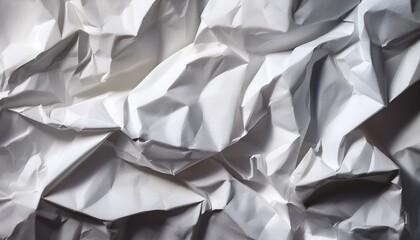 Obraz premium close up of textured white crumpled paper showing deep creases and shadows macro abstract