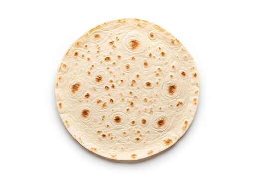 Tortilla bread with brown spots on white surface