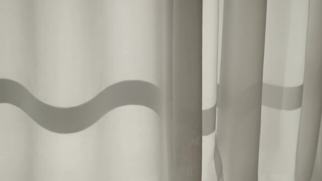 Curtains with wavy gray pattern details.