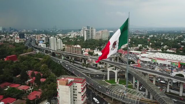  Aerial view of the Mexican flag waving in Mexico City 