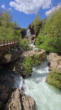 Discover Hadim Goksu Waterfall, a stunning natural wonder in Turkey. Experience the serene beauty of flowing water amid lush greenery and clear blue skies, perfect for relaxation.