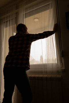 Man with headache, depression, sadness and loneliness at home