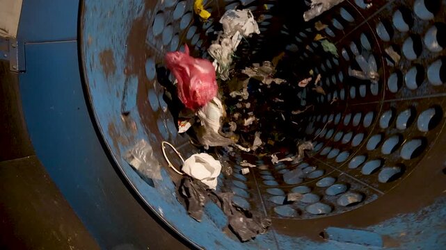 Rotating drum separator processing mixed waste in recycling facility
