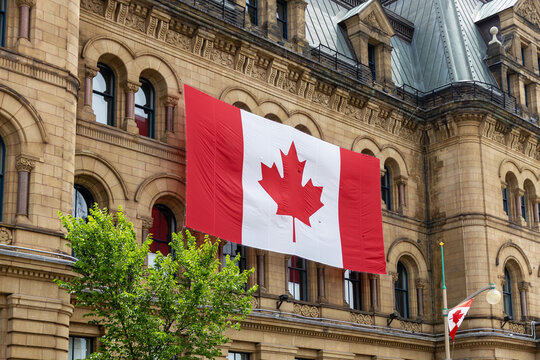 Canadian flag on Office of Prime Minister building on Canada Day in Ottawa.