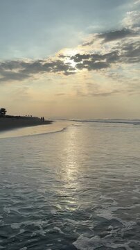 El Pared&oacute;n, Guatemala, is a serene black sand beach with crashing Pacific waves, palm trees, surfers, and breathtaking golden sunsets.
