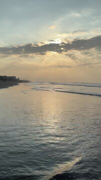 El Pared&oacute;n, Guatemala, is a serene black sand beach with crashing Pacific waves, palm trees, surfers, and breathtaking golden sunsets.