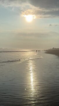 El Pared&oacute;n, Guatemala, is a serene black sand beach with crashing Pacific waves, palm trees, surfers, and breathtaking golden sunsets.