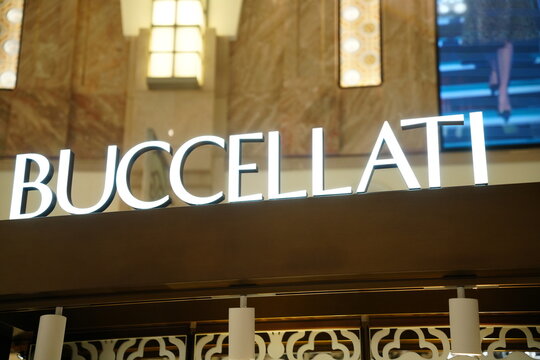 The Buccellati luxury jewelry brand signage with illuminated letters.