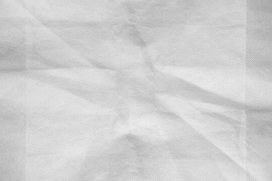 Wrinkled Grey Nonwoven Spunbond Fabric Texture - The Rugged Texture Offers a Strong Visual Aesthetic, Suitable for Fashion Design, Mockups, Posters and Creative Projects.
