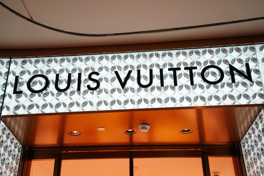 Louis Vuitton luxury brand signage at a retail store entrance.