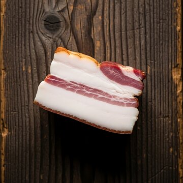 Cured pork fatback with distinct layers of white fat and red meat