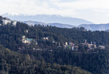 Fototapeta premium aerial view of hill station with clustered buildings on steep slopes
