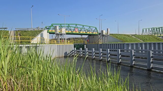 4k shot with river, bridge and grass