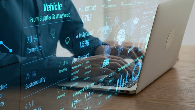 A modern workspace showcasing hands typing on a laptop, enhanced with a digital data overlay that illustrates advanced warehouse management and logistics concepts. Cipher