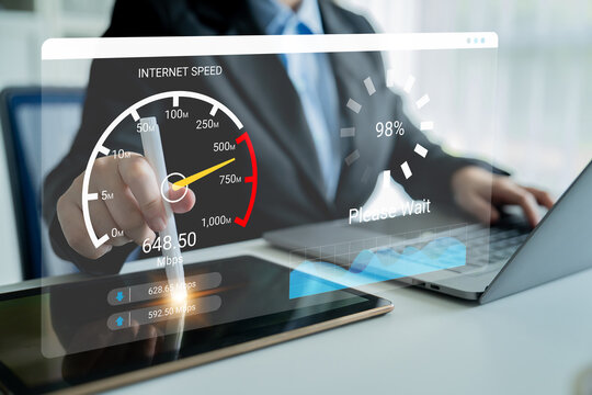 A business professional analyzes internet speed using a tablet and laptop in a modern office. The graphical interface shows real-time performance data for efficient connectivity assessment. Ledger