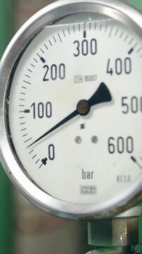 Industrial pressure counter rising slowly close-up