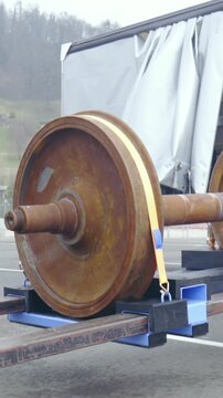 Forklift driving wheelbase cargo towards the trailer gimbal shot