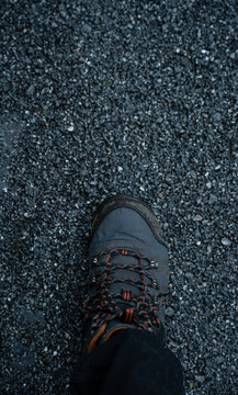 Adventure Concept Hiking Boot Step on Gravel Trail Close Up with copy space, journey and outdoor exploration image