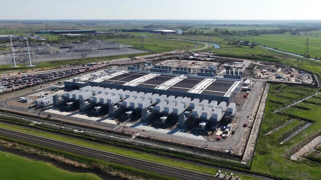 Aerial view of data center construction site and power substation