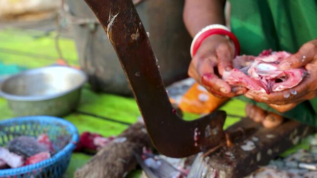 Indian Village Woman Cutting Fresh Fish with Traditional Blade Tool in Rural Market, Manual Food Preparation 4K
