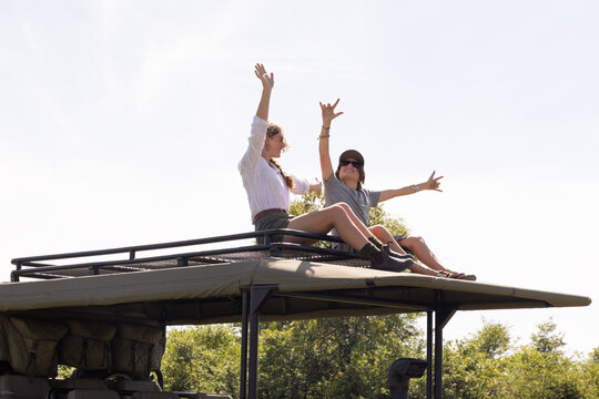 Family experiencing safari in Okavango Delta, Botswana, Africa
