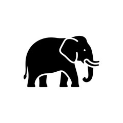 Obraz premium Silhouette of an elephant standing proudly, showcasing its majestic form in black and white.