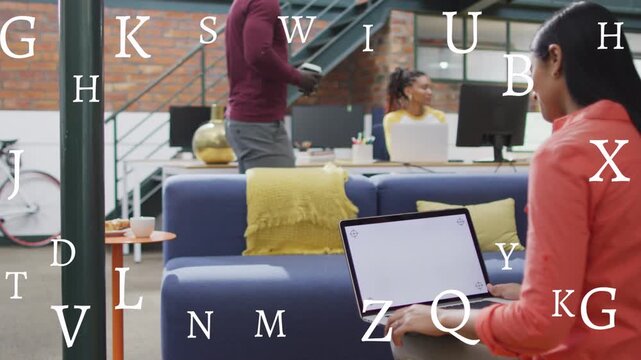 Man walking across business office with cup, greeting peer, letters floating over laptop