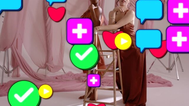 Fashion set two models posing around ladder while icons spawning from front covering creating buzz