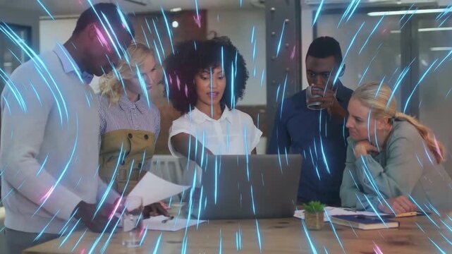 Team lead pointing at laptop team reviewing docs for business goals amid blue pink streaks sweeping