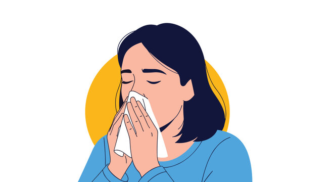 Sick woman with dark hair sneezes into a white paper tissue to prevent the spread of germs during cold and flu season.