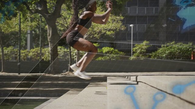 Vertical video: Woman building momentum jumping ledge landing for fitness blue overlay marking form