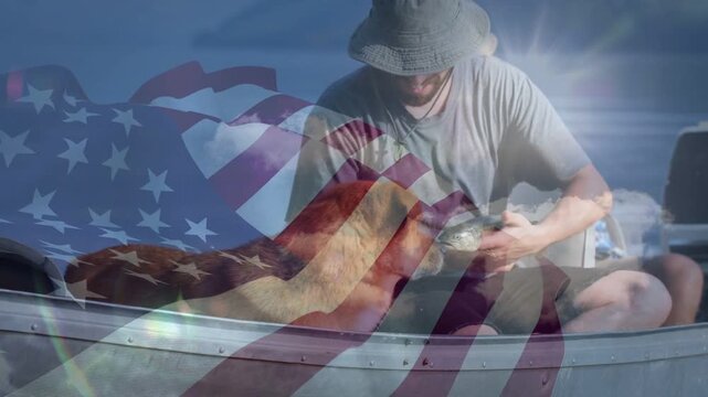 After landing fishing catch, angler leaning, removing hook, dog nudging, American flag overlaying