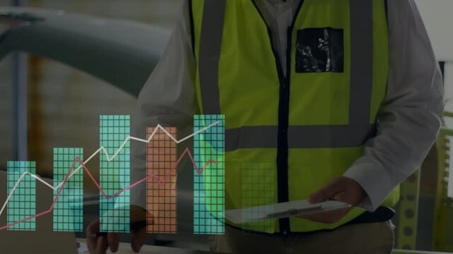 Plant manager touching laptop trackpad tapping and reviewing expanding charts checking metrics