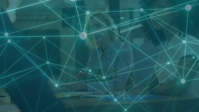 Center woman gesturing as peer pointing while teal network drifting across laptop for business plan