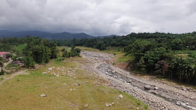 Agam, Indonesia - April 3rd 2026: Aerial Drone Forward Tracking of Emergency Bridge Over Widened River in Salareh Aia: Vital Temporary Infrastructure After Catastrophic Flash Flood