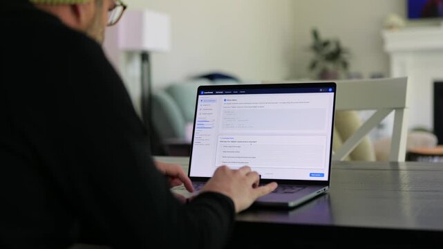 Older male university student receives alert warning notification for violating academic integrity policies by using AI chatbot for assignment concept