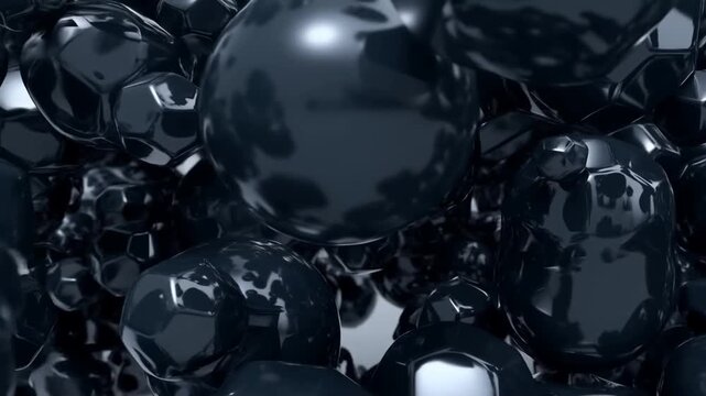 Slow motion tracking close up of metallic glossy spheres and faceted polyhedra tumbling and colliding in dark studio interior